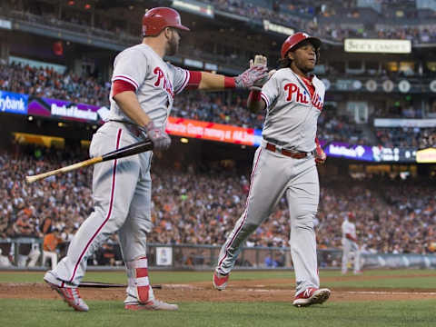 Jun 24, 2016; San Francisco, CA, USA; Philadelphia Phillies third baseman Franco (7) is congratulated by catcher Rupp (29) after scoring in the fourth inning against the San Francisco Giants at AT&T Park. Mandatory Credit: Neville E. Guard-USA TODAY Sport