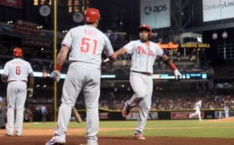 Jun 28, 2016; Phoenix, AZ, USA; Philadelphia Phillies third baseman Franco (7) is congratulated by catcher Ruiz (51) after hitting a solo home run in the fifth inning against the Arizona Diamondbacks at Chase Field. Mandatory Credit: Joe Camporeale-USA TODAY Sports