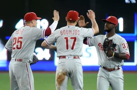 Jun 13, 2016; Toronto, Ontario, CAN; Philadelphia Phillies left fielder Asche (25), right fielder Bourjos (17) and center fielder Herrera (37) celebrate a 7-0 win over Toronto Blue Jays at Rogers Centre. Mandatory Credit: Dan Hamilton-USA TODAY Sports