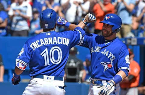 Jun 11, 2016; Toronto, Ontario, CAN; Toronto Blue Jays designated hitter Encarnacion (10) is greeted at home plate by catcher Martin (55) after hitting a three run home run against the Baltimore Orioles in the sixth inning at Rogers Centre. Mandatory Credit: Dan Hamilton-USA TODAY Sports