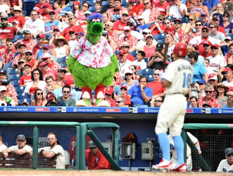 Jun 19, 2016; Philadelphia, PA, USA; The Phillie Phanatic watches as Philadelphia Phillies second baseman Cesar Hernandez (16) heads back to the dugout after striking out against the Arizona Diamondbacks at Citizens Bank Park. The Diamondbacks defeated the Phillies, 5-1. Mandatory Credit: Eric Hartline-USA TODAY Sports