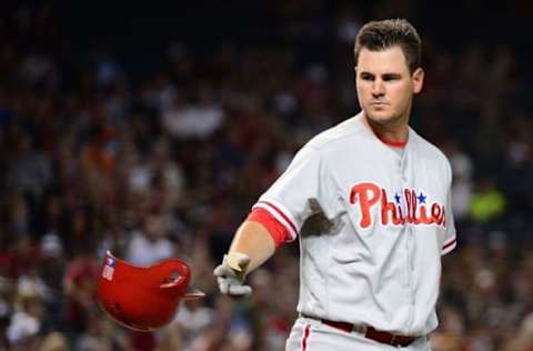 Jun 27, 2016; Phoenix, AZ, USA; Philadelphia Phillies infielder Joseph (19) throws his helmet after striking out against the Arizona Diamondbacks during the third inning at Chase Field. Mandatory Credit: Jennifer Stewart-USA TODAY Sports