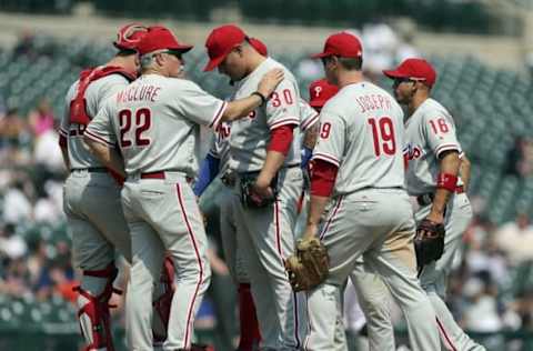 May 25, 2016; Detroit, MI, USA; Philadelphia Phillies pitching coach Bob McClure (22) has a meeting on the mound with relief pitcher Hernandez (30) during the seventh inning against the Detroit Tigers at Comerica Park. Phillies win 8-5. Mandatory Credit: Raj Mehta-USA TODAY Sports