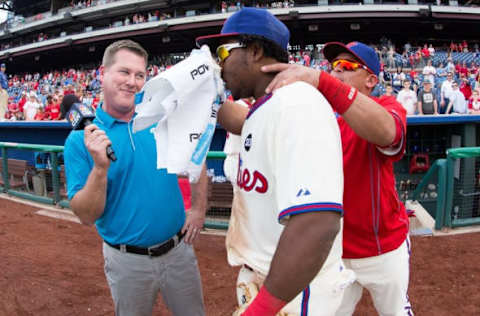 May 17, 2015; Philadelphia, PA, USA; Philadelphia Phillies third baseman Franco (7) is pied in the face by catcher Ruiz (51) while being interviewed by CSN host Gregg Murphy after defeating the Arizona Diamondbacks at Citizens Bank Park. The Phillies won 6-0. Mandatory Credit: Bill Streicher-USA TODAY Sports