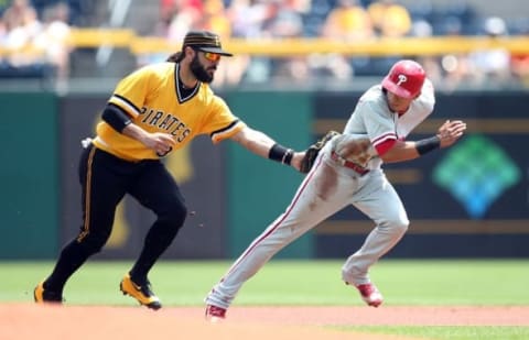 Jul 24, 2016; Pittsburgh, PA, USA; Pittsburgh Pirates shortstop Sean Rodriguez (3) tags out Philadelphia Phillies second baseman Cesar Hernandez (R) in a caught stealing run down during the first inning at PNC Park. Mandatory Credit: Charles LeClaire-USA TODAY Sports