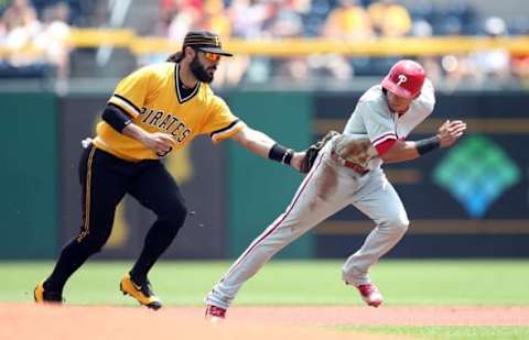 Jul 24, 2016; Pittsburgh, PA, USA; Pittsburgh Pirates fshortstop Rodriguez (3) tags out Philadelphia Phillies second baseman Hernandez (R) in a caught stealing run down during the first inning at PNC Park. Mandatory Credit: Charles LeClaire-USA TODAY Sports