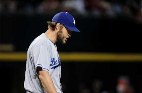 Jun 15, 2016; Phoenix, AZ, USA; Los Angeles Dodgers starting pitcher Clayton Kershaw (22) reacts after giving up a home run to Arizona Diamondbacks left fielder Rickie Weeks (not pictured) in the second inning at Chase Field. Mandatory Credit: Matt Kartozian-USA TODAY Sports