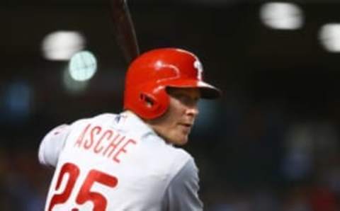 Jun 29, 2016; Phoenix, AZ, USA; Philadelphia Phillies outfielder Cody Asche hits a sacrifice fly resulting in an RBI in the eighth inning against the Arizona Diamondbacks at Chase Field. The Phillies defeated the Diamondbacks 9-8 in 10 innings. Mandatory Credit: Mark J. Rebilas-USA TODAY Sports