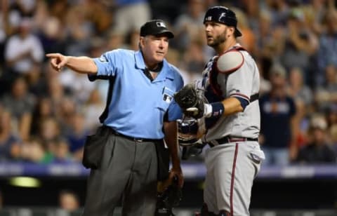 Jul 21, 2016; Denver, CO, USA; Atlanta Braves catcher Pierzynski (15) reacts to a base running interference call by umpire Mike Winters (33) allowing Colorado Rockies first baseman Daniel Descalso (3) (not pictured) to score in the eighth inning at Coors Field. The Rockies defeated the Braves 7-3. Mandatory Credit: Ron Chenoy-USA TODAY Sports