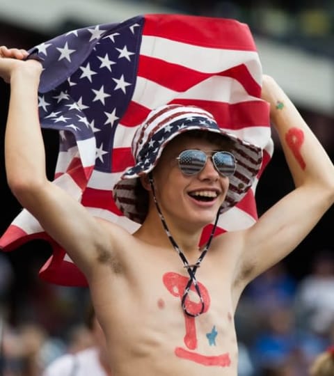 Jul 1, 2016; Philadelphia, PA, USA; A Philadelphia Phillies fan holds an American flag during the first inning against the Kansas City Royals at Citizens Bank Park. Mandatory Credit: Bill Streicher-USA TODAY Sports