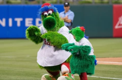 Jul 2, 2016; Philadelphia, PA, USA; The Phillie Phanatic dances with a young fan dressed in a Phanatic costume between innings against the Kansas City Royals at Citizens Bank Park. The Royals won 6-2. Mandatory Credit: Bill Streicher-USA TODAY Sports