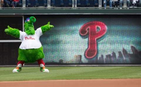 May 18, 2016; Philadelphia, PA, USA; The Phillie Phanatic entertains in front of a scoreboard prior to action against the Miami Marlins at Citizens Bank Park. The Philadelphia Phillies won 4-2. Mandatory Credit: Bill Streicher-USA TODAY Sports