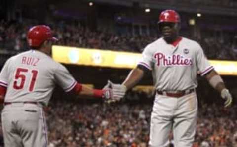 Jul 11, 2015; San Francisco, CA, USA; Philadelphia Phillies catcher Ruiz (51) greets first baseman Howard (6) after his solo home run in the sixth inning against the San Francisco Giants at AT&T Park. Mandatory Credit: Lance Iversen-USA TODAY Sports