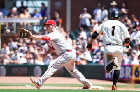 Jun 26, 2016; San Francisco, CA, USA; Philadelphia Phillies first baseman Tommy Joseph (19) forces out San Francisco Giants second baseman Ramiro Pena (1) during the fifth inning at AT&T Park. Mandatory Credit: Kelley L Cox-USA TODAY Sports