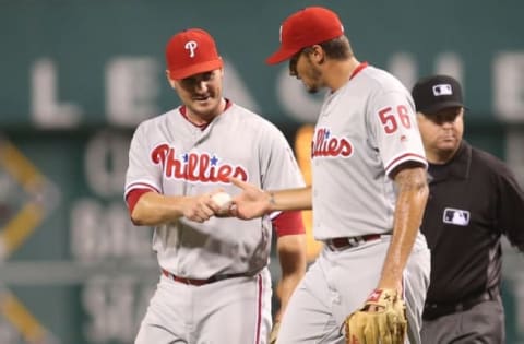 Jul 22, 2016; Pittsburgh, PA, USA; Philadelphia Phillies first baseman Joseph (L) hands starting pitcher Eflin (56) the game ball after Eflin pitched a complete game shut-out against the Pittsburgh Pirates at PNC Park. The Phillies defeated the Pirates 4-0. Mandatory Credit: Charles LeClaire-USA TODAY Sports