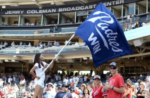 Aug 19, 2015; San Diego, CA, USA; A member of the San Diego Padres Pad Squad waves the victory flag after a 3-2 win over the Atlanta Braves to complete a sweep of the series at Petco Park. Mandatory Credit: Jake Roth-USA TODAY Sports