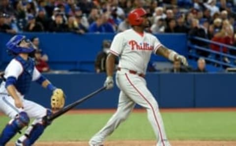 Jun 13, 2016; Toronto, Ontario, CAN; Philadelphia Phillies designated hitter Ryan Howard (6) hits a solo home run against Toronto Blue Jays in the seventh inning at Rogers Centre. Mandatory Credit: Dan Hamilton-USA TODAY Sports