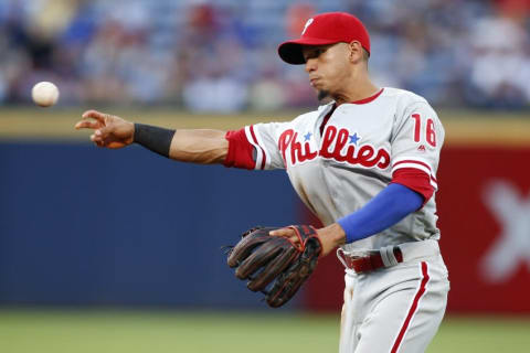 Jul 28, 2016; Atlanta, GA, USA; Philadelphia Phillies second baseman Cesar Hernandez (16) throws a runner out at first against the Atlanta Braves in the second inning at Turner Field. Mandatory Credit: Brett Davis-USA TODAY Sports