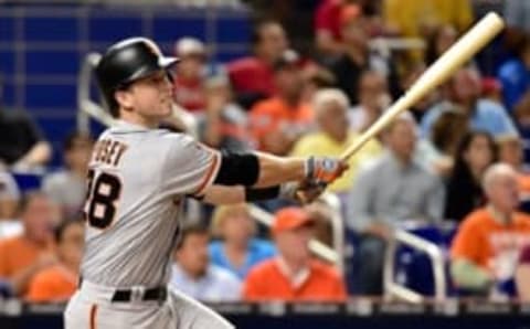 Aug 8, 2016; Miami, FL, USA; San Francisco Giants catcher Buster Posey (28) connects for an RBI double during the fifth inning against the Miami Marlins at Marlins Park. Mandatory Credit: Steve Mitchell-USA TODAY Sports