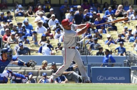 Aug 10, 2016; Los Angeles, CA, USA; Philadelphia Phillies catcher Carlos Ruiz (51) gets a hit against the Los Angeles Dodgers in the seventh inning at Dodger Stadium. Mandatory Credit: Richard Mackson-USA TODAY Sports