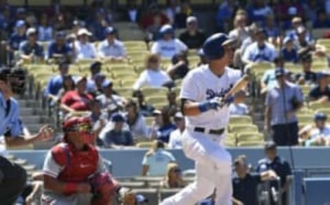 Aug 10, 2016; Los Angeles, CA, USA; Los Angeles Dodgers shortstop Corey Seager (5) hits a double against the Philadelphia Phillies in the eighth inning at Dodger Stadium. Mandatory Credit: Richard Mackson-USA TODAY Sports