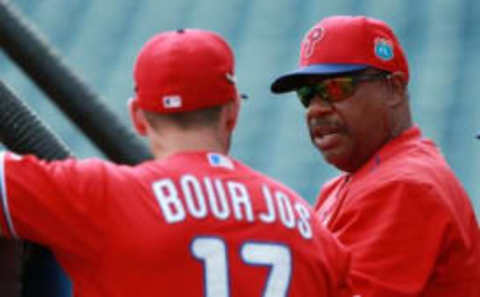 Mar 13, 2016; Tampa, FL, USA; Philadelphia Phillies hitting coach Steve Henderson (5) talks with center fielder Peter Bourjos (17) prior to the game against the New York Yankees at George M. Steinbrenner Field. Mandatory Credit: Kim Klement-USA TODAY Sports