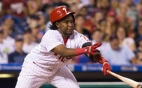 Jul 15, 2016; Philadelphia, PA, USA; Philadelphia Phillies third baseman Maikel Franco (7) hits into an RBI fielders choice during the sixth inning against the New York Mets at Citizens Bank Park. Mandatory Credit: Bill Streicher-USA TODAY Sports