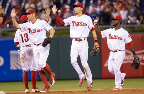 Jul 20, 2016; Philadelphia, PA, USA; Philadelphia Phillies right fielder Bourjos (17) and left fielder Goeddel (2) and center fielder Herrera (37) celebrate a victory against the Miami Marlins at Citizens Bank Park. The Philadelphia Phillies won 4-1. Mandatory Credit: Bill Streicher-USA TODAY Sports