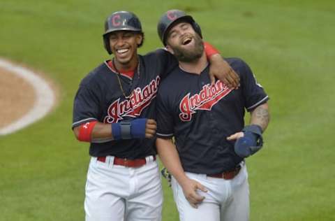 Aug 11, 2016; Cleveland, OH, USA; Cleveland Indians shortstop Lindor (12) and first baseman  Napoli (26) react after scoring in the first inning against the Los Angeles Angels at Progressive Field. Mandatory Credit: David Richard-USA TODAY Sports