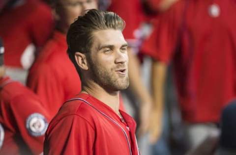 Sep 3, 2016; New York City, NY, USA; Washington Nationals right fielder Harper (34) reacts with a teammate in the dugout before a game against the New York Mets at Citi Field. Mandatory Credit: Gregory J. Fisher-USA TODAY Sports