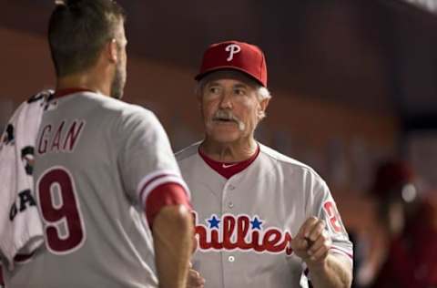 Sep 5, 2016; Miami, FL, USA; Philadelphia Phillies pitching coach Bob McClure (right) talks with Phillies starting pitcher Adam Morgan (left) in the dugout during the seventh inning against the Miami Marlins at Marlins Park. Mandatory Credit: Steve Mitchell-USA TODAY Sports