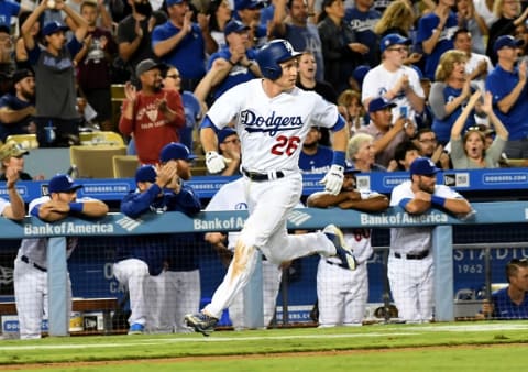 Sep 24, 2016; Los Angeles, CA, USA; Los Angeles Dodgers second baseman Chase Utley (26) runs toward home plate to score a run in the seventh inning of the game against the Colorado Rockies at Dodger Stadium. Dodgers won 14-1. Mandatory Credit: Jayne Kamin-Oncea-USA TODAY Sports