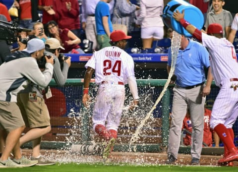 Sep 12, 2016; Philadelphia, PA, USA; Philadelphia Phillies right fielder Roman Quinn (24) reacts after having Powerade dumped on him during post game interview after win against the Pittsburgh Pirates at Citizens Bank Park. The Phillies defeated the Pirates, 6-2. Mandatory Credit: Eric Hartline-USA TODAY Sports