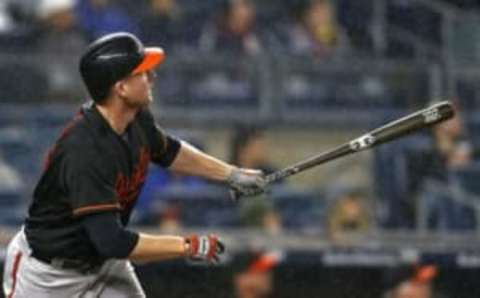 Sep 30, 2016; Bronx, NY, USA; Baltimore Orioles right fielder Mark Trumbo (45) hits a 2-run home run during the fifth inning against the New York Yankees at Yankee Stadium. Mandatory Credit: Adam Hunger-USA TODAY Sports