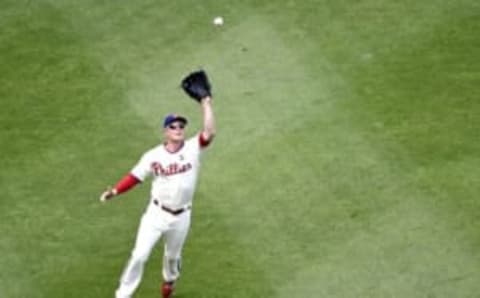 Jun 28, 2015; Philadelphia, PA, USA; Philadelphia Phillies third baseman Cody Asche (25) catches fly ball during the fifth inning against the Washington Nationals at Citizens Bank Park. Mandatory Credit: Eric Hartline-USA TODAY Sports