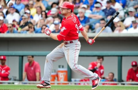 Mar 5, 2016; Mesa, AZ, USA; Cincinnati Reds center fielder Jake Cave (30) singles in the third inning against the Chicago Cubs at Sloan Park. Mandatory Credit: Matt Kartozian-USA TODAY Sports