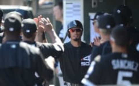 Mar 10, 2016; Surprise, AZ, USA; Chicago White Sox center fielder Jacob May (86) slaps hands with teammates after scoring a run during the first inning against the Texas Rangers at Surprise Stadium. Mandatory Credit: Joe Camporeale-USA TODAY Sports