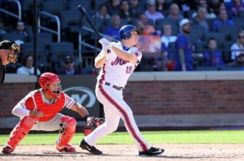 Sep 25, 2016; New York City, NY, USA; New York Mets right fielder Jay Bruce (19) hits a single during the fifth inning against the Philadelphia Phillies at Citi Field. Mandatory Credit: Anthony Gruppuso-USA TODAY Sports