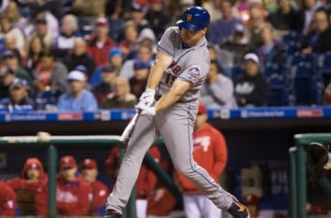 Sep 30, 2016; Philadelphia, PA, USA; New York Mets right fielder Jay Bruce (19) hits an RBI single against the Philadelphia Phillies during the fourth inning at Citizens Bank Park. Mandatory Credit: Bill Streicher-USA TODAY Sports