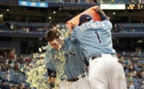 Aug 9, 2015; St. Petersburg, FL, USA; Tampa Bay Rays designator hitter Richie Shaffer (36) gets gatorade dumped on him by second baseman Tim Beckham (1) after defeating the New York Mets at Tropicana Field. Tampa Bay Rays defeated the New York Mets 4-3. Mandatory Credit: Kim Klement-USA TODAY Sports