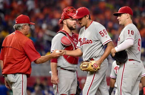 Jul 27, 2016; Miami, FL, USA; Philadelphia Phillies starting pitcher Zach Eflin (56) is taken out of the game by Phillies manager Pete Mackanin (45) during the sixth inning against the Miami Marlins at Marlins Park. The Marlins won 11-1. Mandatory Credit: Steve Mitchell-USA TODAY Sports