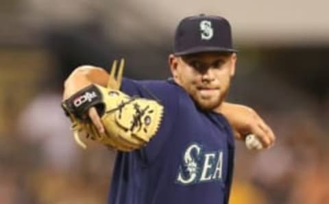 Jul 27, 2016; Pittsburgh, PA, USA; Seattle Mariners relief pitcher David Rollins (59) pitches against the Pittsburgh Pirates during the eighth inning in an inter-league game at PNC Park. The Pirates won 10-1. Mandatory Credit: Charles LeClaire-USA TODAY Sports