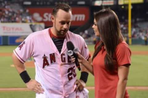 Jul 28, 2016; Anaheim, CA, USA; Fox Sports broadcaster Alex Curry (R) interviews Los Angeles Angels left fielder Daniel Nava (25) after the game against the Boston Red Sox at Angel Stadium of Anaheim. The Angels defeated the Red Sox 2-1. Mandatory Credit: Kirby Lee-USA TODAY Sports