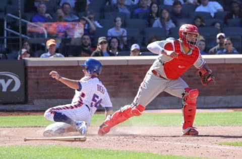 Sep 25, 2016; New York City, NY, USA; Philadelphia Phillies catcher Jorge Alfaro (38) forces out New York Mets third baseman T.J. Rivera (54) during the fourth inning at Citi Field. Mandatory Credit: Anthony Gruppuso-USA TODAY Sports