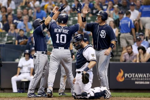 MILWAUKEE, WI – AUGUST 09: Hunter Renfroe #10 of the San Diego Padres celebrates with teammates past Manny Pina #9 of the Milwaukee Brewers after hitting a grand slam in the ninth inning at Miller Park on August 9, 2018 in Milwaukee, Wisconsin. (Photo by Dylan Buell/Getty Images)