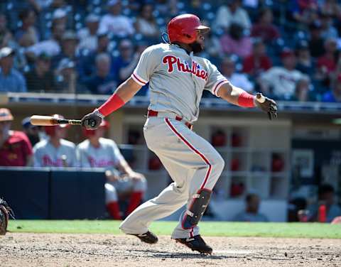 SAN DIEGO, CA – AUGUST 12: Carlos Santana #41 of the Philadelphia Phillies hits an RBI double during the eighth inning of a baseball game against the San Diego Padres at PETCO Park on August 12, 2018 in San Diego, California. (Photo by Denis Poroy/Getty Images)