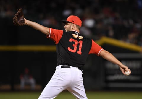 PHOENIX, AZ – AUGUST 25: Brad Boxberger #31 of the Arizona Diamondbacks delivers a ninth inning pitch against the Seattle Mariners at Chase Field on August 25, 2018 in Phoenix, Arizona. All players across MLB will wear nicknames on their backs as well as colorful, non-traditional uniforms featuring alternate designs inspired by youth-league uniforms during Players Weekend. (Photo by Norm Hall/Getty Images)