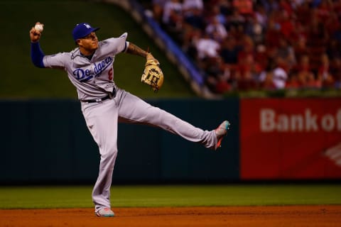 ST. LOUIS, MO – SEPTEMBER 13: Manny Machado #8 of the Los Angeles Dodgers throws to first base against the St. Louis Cardinals in the sixth inning at Busch Stadium on September 13, 2018 in St. Louis, Missouri. (Photo by Dilip Vishwanat/Getty Images)