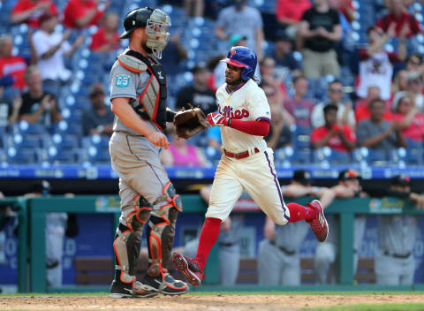 PHILADELPHIA, PA – SEPTEMBER 16: Roman Quinn #24 of the Philadelphia Phillies scores past catcher Bryan Holaday #28 of the Miami Marlins on an error by second baseman Starlin Castro #13 on a ball hit by Cesar Hernandez #16 during the ninth inning of a game at Citizens Bank Park on September 16, 2018 in Philadelphia, Pennsylvania. The Marlins defeated the Phillies 6-4. (Photo by Rich Schultz/Getty Images)