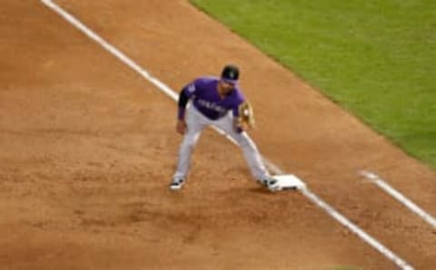 PHOENIX, AZ – SEPTEMBER 23: Ian Desmond #20 of the Colorado Rockies makes a play at first base during the bottom of the sixth inning at Chase Field against the Arizona Diamondbacks on September 23, 2018 in Phoenix, Arizona. The Rockies beat the Diamondbacks 2-0. (Photo by Chris Coduto/Getty Images)